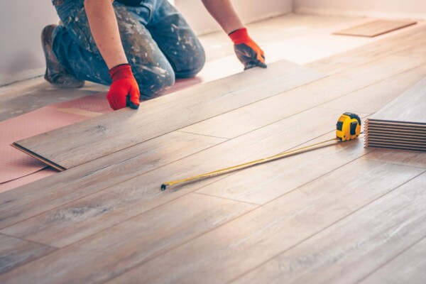 A man carrying out flooring work